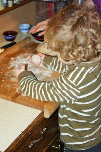 Here three year old LM has his first ball of bread dough to play with.